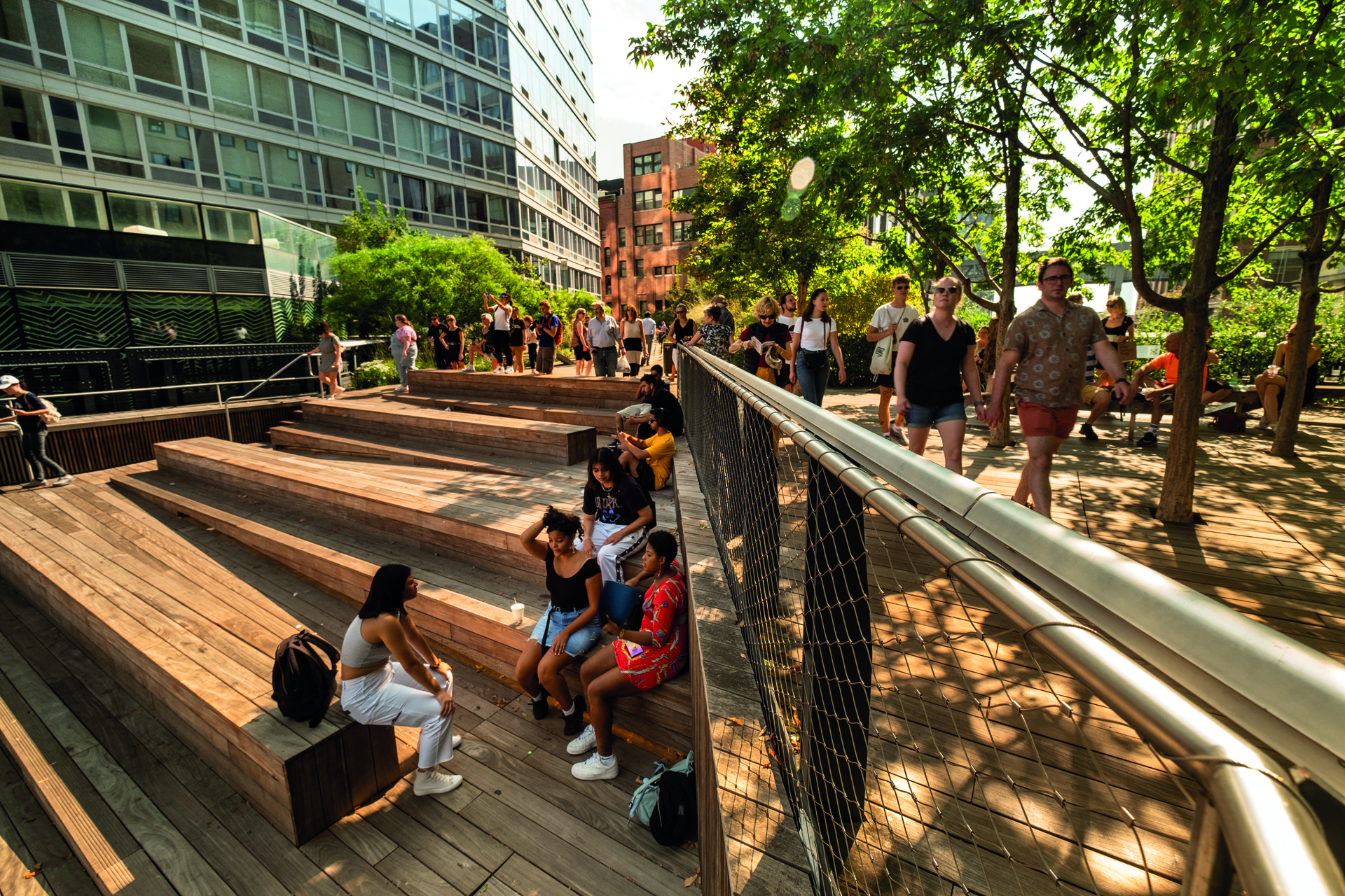 Manhattan, New York - September 23, 2019:  People walk along on the High Line elevated pedestrian walkway which runs along an old railway track from the meatpacking district through to Chelsea in downtown Manhattan New York City USA