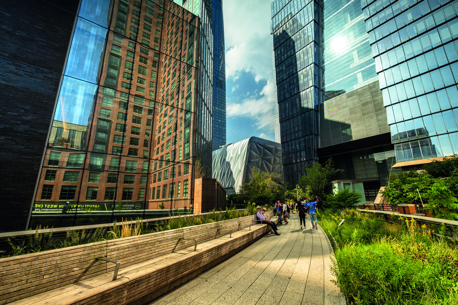 Manhattan, New York - September 23, 2019:  People walk along on the High Line elevated pedestrian walkway which runs along an old railway track from the meatpacking district through to Chelsea in downtown Manhattan New York City USA